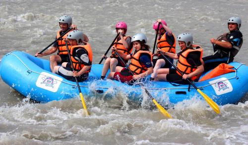 a group of people in a raft in the water at Doors in Kutaisi