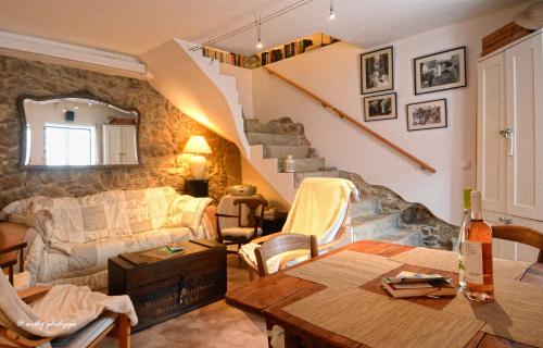 a living room with a couch and a table at Casa de Peniche in Peniche
