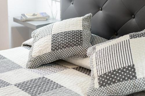 En eller flere senge i et værelse på Centrico y parking gratuito Vut 142 as