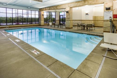 a large swimming pool with blue water at Holiday Inn South Jordan - SLC South by IHG in South Jordan