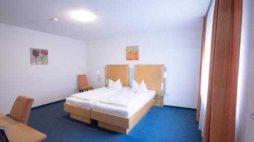 Postel nebo postele na pokoji v ubytování Hotel Elite