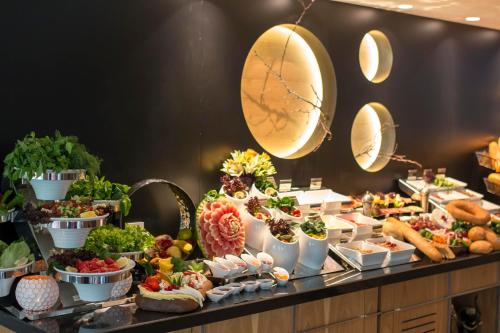 a buffet with a lot of food on a table at Sky Kamer Hotel Antalya in Antalya