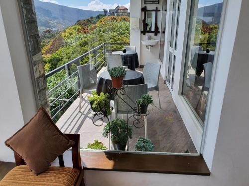 a balcony with a view of the mountains at Tranquil Villa in Nuwara Eliya