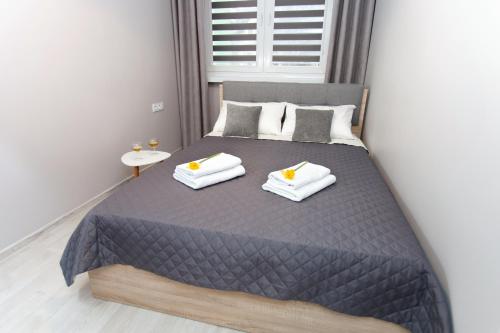 Posteľ alebo postele v izbe v ubytovaní Apartament u Jankiego