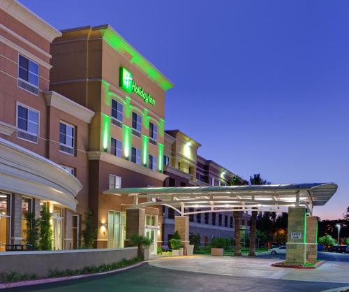 a rendering of a hotel with a lit up entrance at Holiday Inn Ontario Airport - California, an IHG Hotel in Ontario