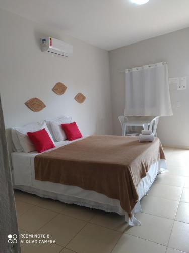 En eller flere senger på et rom på Pousada Quinta do Patacho