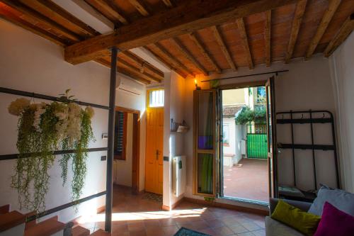 a living room with an open door to a patio at Silvia in S.Reparata in Florence
