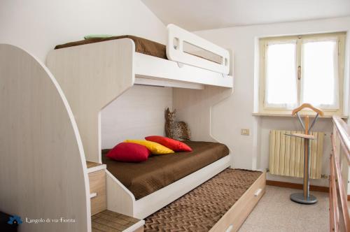 Ένα ή περισσότερα κρεβάτια σε δωμάτιο στο Angolo di Via Fiorita