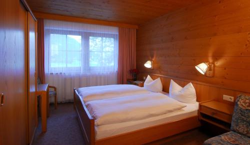 Postel nebo postele na pokoji v ubytování Zillertal Apartments