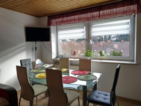 a dining room with a table and chairs and a window at Four Season Apartment Irene in Eisenerz