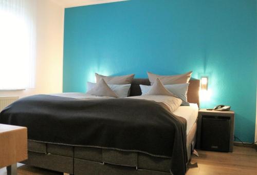 Postel nebo postele na pokoji v ubytování Hotel Schmerkötter