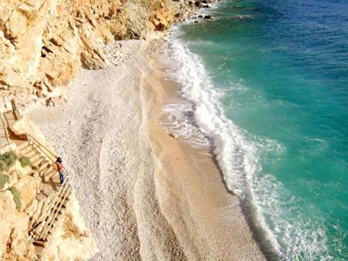an aerial view of a beach next to the ocean at Apartments Grand Pinea in Čilipi