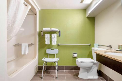 a bathroom with a toilet and a sink at Sleep Inn I-95 North Savannah in Port Wentworth