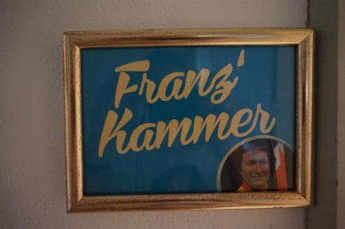 a sign with a picture of a man in a mirror at Viehberghütte in Sandl