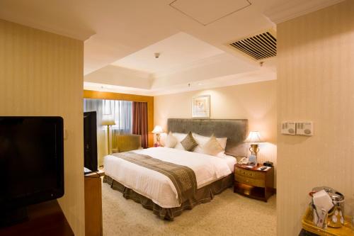 Postel nebo postele na pokoji v ubytování Crowne Plaza Qingdao by IHG