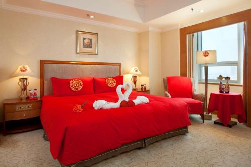 Postel nebo postele na pokoji v ubytování Crowne Plaza Qingdao by IHG