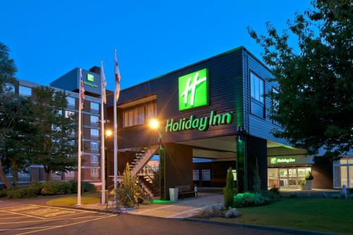 a building with a sign that reads holiday inn at Holiday Inn Washington by IHG in Washington