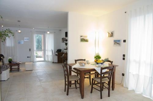 a dining room with a table and chairs at B&B Marostica in Marostica