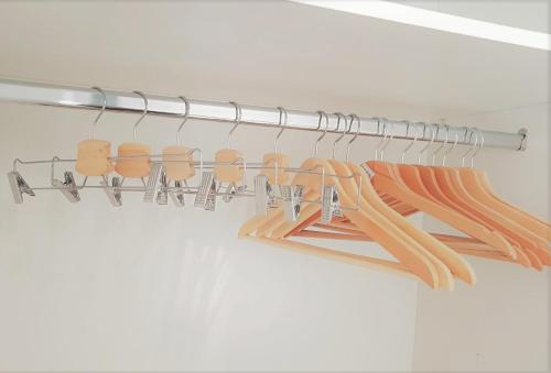 a closet with a bunch of hangers at Spitaki Apartments Potos in Potos