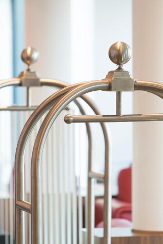 a pair of metal chairs in a room at Bastion Hotel Amsterdam Airport in Hoofddorp