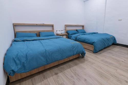 En eller flere senge i et værelse på 一九六民宿