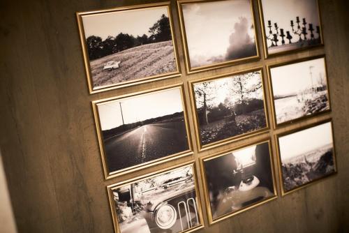 a window with pictures in it on a wall at S'CASA NishiShinjuku in Tokyo
