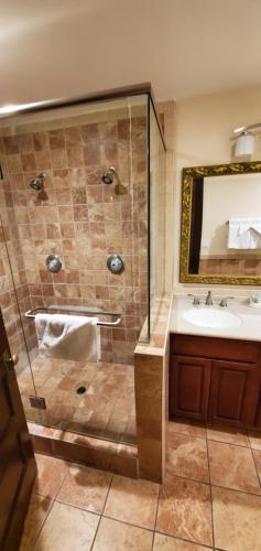 a bathroom with a shower and a sink at Glen Tavern Inn in Santa Paula