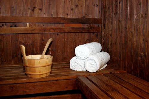a stack of rolled towels in a sauna at Holiday Inn Tabuk by IHG in Tabuk