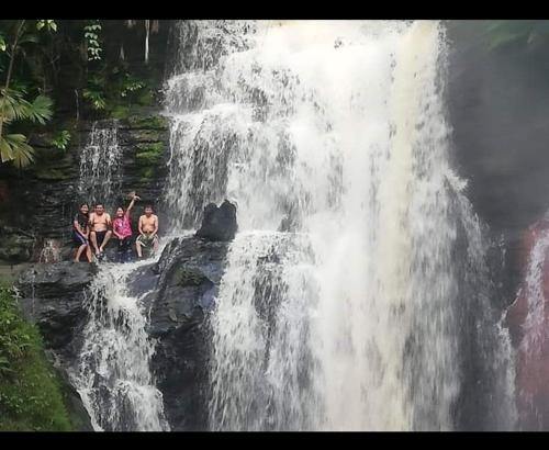 a group of people sitting on top of a waterfall at Hospedaje Independencia Pucallpa in Pucallpa