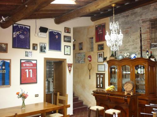 a dining room with a table and a chandelier at San Gennaro Castello in San Gennaro