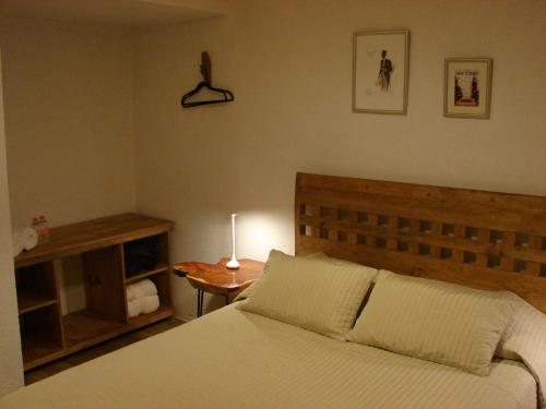 Ένα ή περισσότερα κρεβάτια σε δωμάτιο στο Casa Olivos Centro de Tequisquiapan para 6 pers