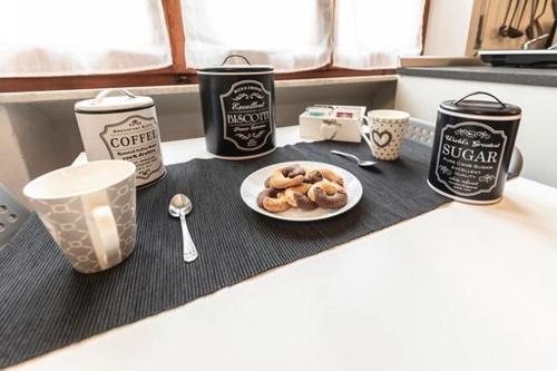 a table with a plate of donuts on a counter at La Casina di Mira in Montepulciano