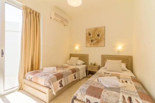 Ένα ή περισσότερα κρεβάτια σε δωμάτιο στο Renes Paradise Seahome - Afandou Beach, Rhodes