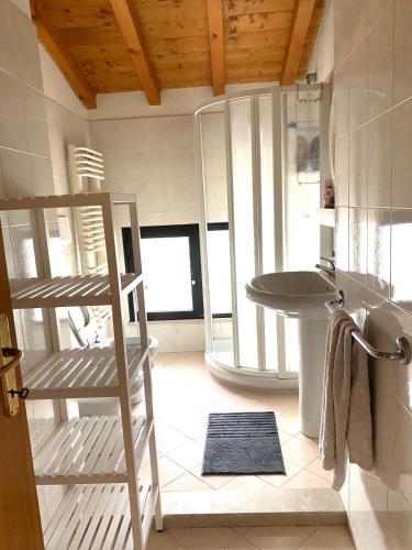a bathroom with a sink and a ladder in a room at Tenuta EnGi in Verona