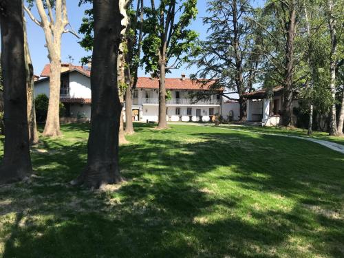 a house in the middle of a yard with trees at ANTICA VILLA CUNEO- Guest House - "B&B e non un Hotel a Cuneo" in Cuneo