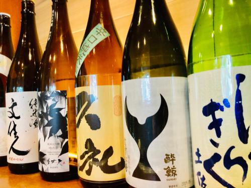 a group of bottles of wine on a table at Hotel Takasago in Kochi