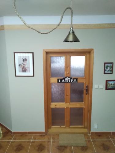 a room with a door with a sign on it at Lomnice nad Popelkou in Lomnice nad Popelkou