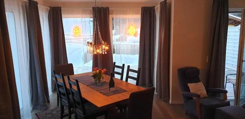 a dining room with a table and chairs and a dining room at Chalet Taube in Bad Gastein