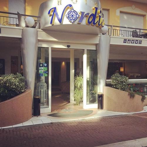 a hotel with a sign on the front of it at Hotel Nordic in Bellaria-Igea Marina