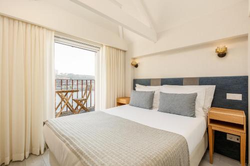 
Uma cama ou camas num quarto em Your Opo Ribeira Apartments Porto
