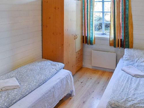 Ένα ή περισσότερα κρεβάτια σε δωμάτιο στο 6 person holiday home in Aukra