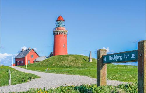 a lighthouse on top of a hill with a street sign at Lovely Apartment In Lemvig With Kitchen in Lemvig