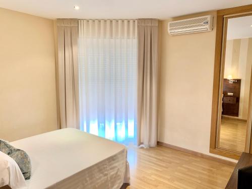 Hotel Fernando IVにあるベッド