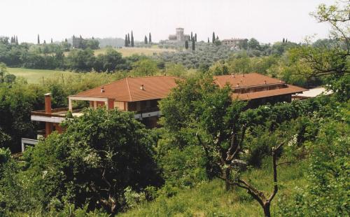 
a small town with trees and houses at Residence Hotel Health House in Desenzano del Garda
