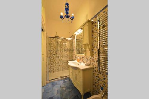 a bathroom with a sink and a mirror at Luxury Apartment Amalfi in Amalfi