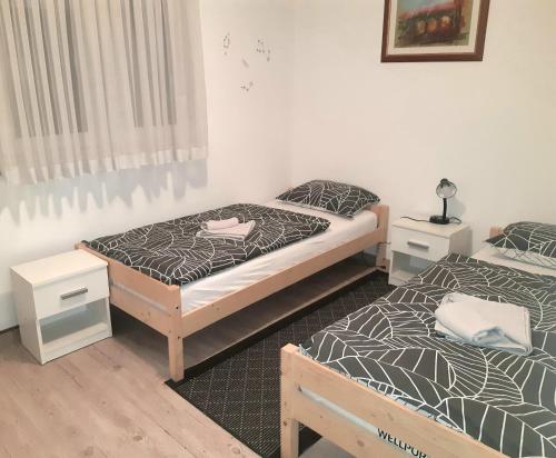 Postel nebo postele na pokoji v ubytování Apartman Lucija
