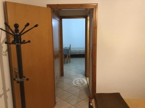 a hallway with a door open to a room with a view at Katerina & Efi Apartments in Mastichari