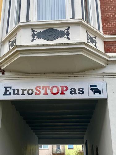 a store sign on the side of a building at Eurostopas in Bremen