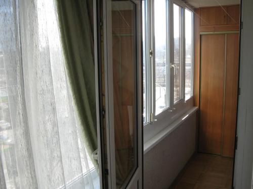 a room with a window with a view of a city at Irina HOME in Kyiv