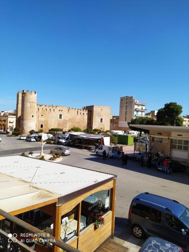 a view of a parking lot with a building at Agli Antichi Quartieri Apartments & Room in Alcamo